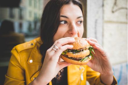 woman eating high calorie food