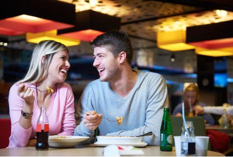 Two people eating at restaurant